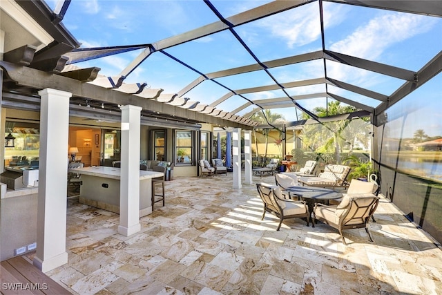 view of patio featuring a lanai and exterior bar