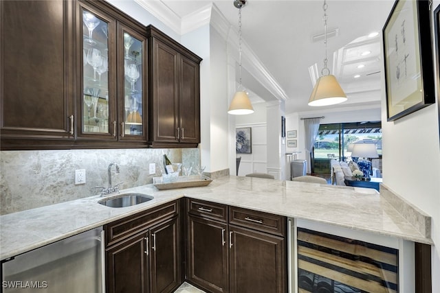 kitchen featuring pendant lighting, dishwasher, sink, wine cooler, and ornamental molding