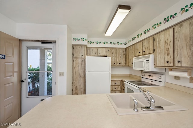 kitchen with sink and white appliances