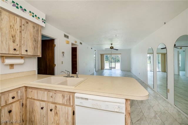 kitchen featuring white dishwasher, light brown cabinets, kitchen peninsula, and sink