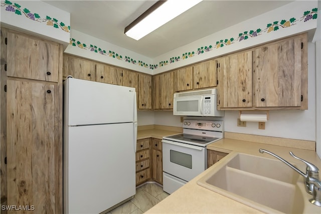 kitchen with white appliances and sink