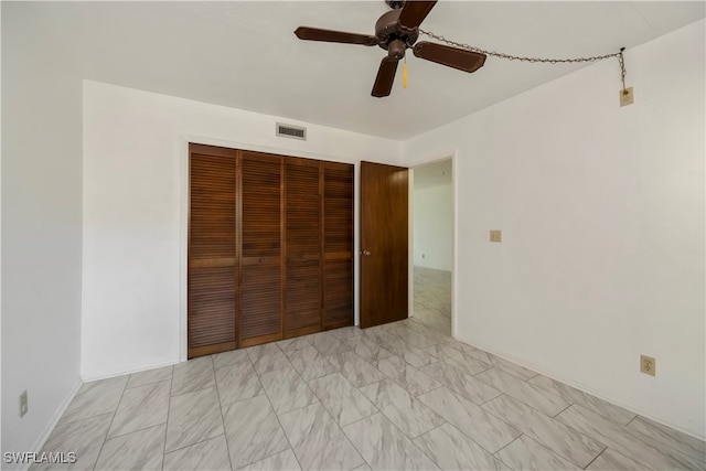 unfurnished bedroom featuring a closet and ceiling fan