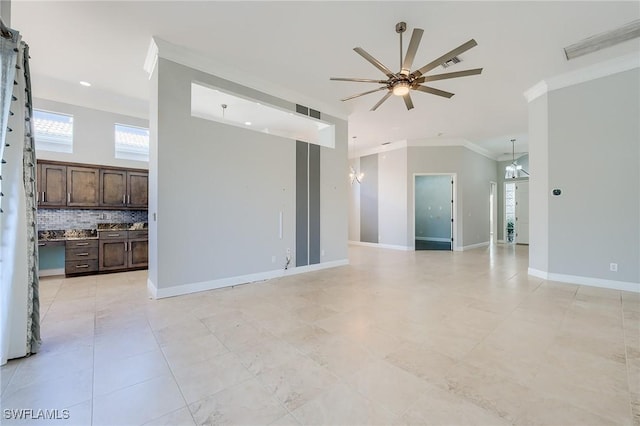 empty room with ceiling fan and ornamental molding