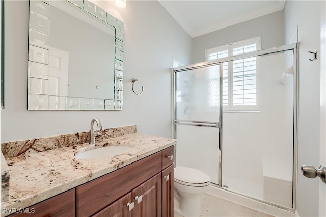 bathroom featuring vanity, toilet, and a shower with door