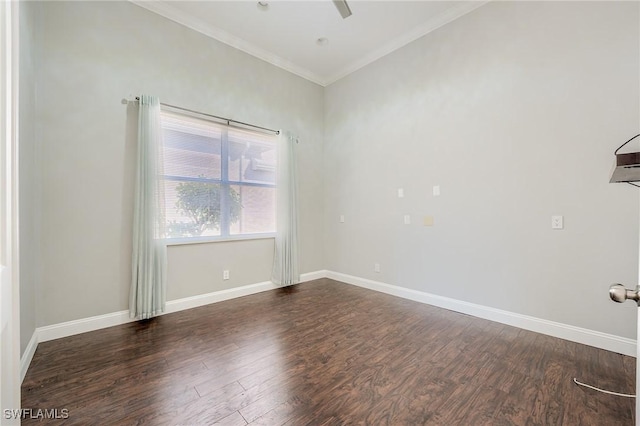 spare room with dark hardwood / wood-style floors and ornamental molding