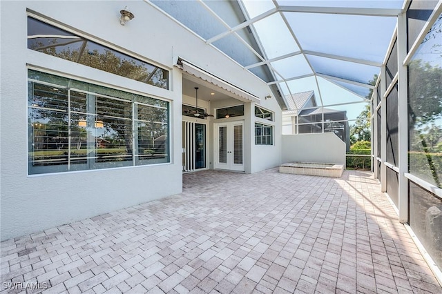 unfurnished sunroom with french doors and vaulted ceiling