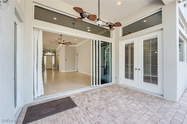 view of patio / terrace featuring ceiling fan and french doors