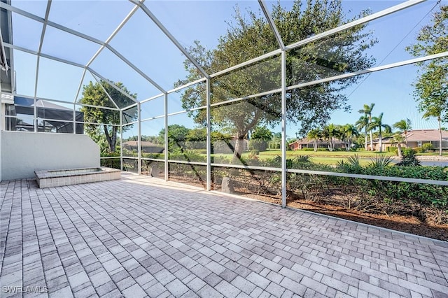 view of patio with a lanai