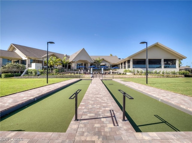 view of home's community featuring a lawn