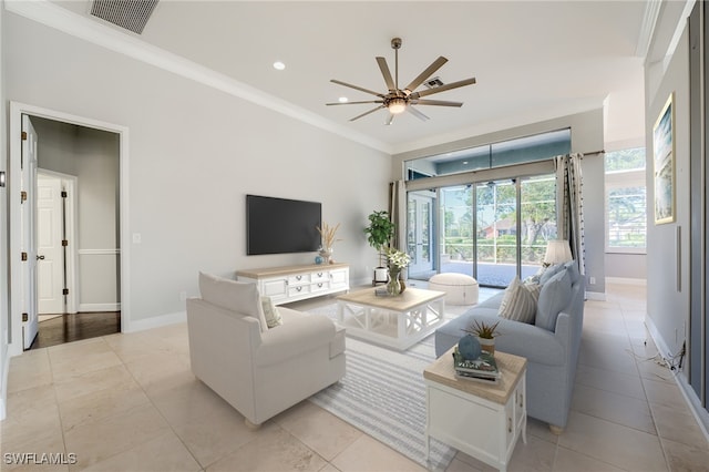 tiled living room featuring ceiling fan and ornamental molding