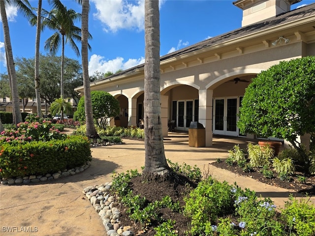 rear view of property with french doors