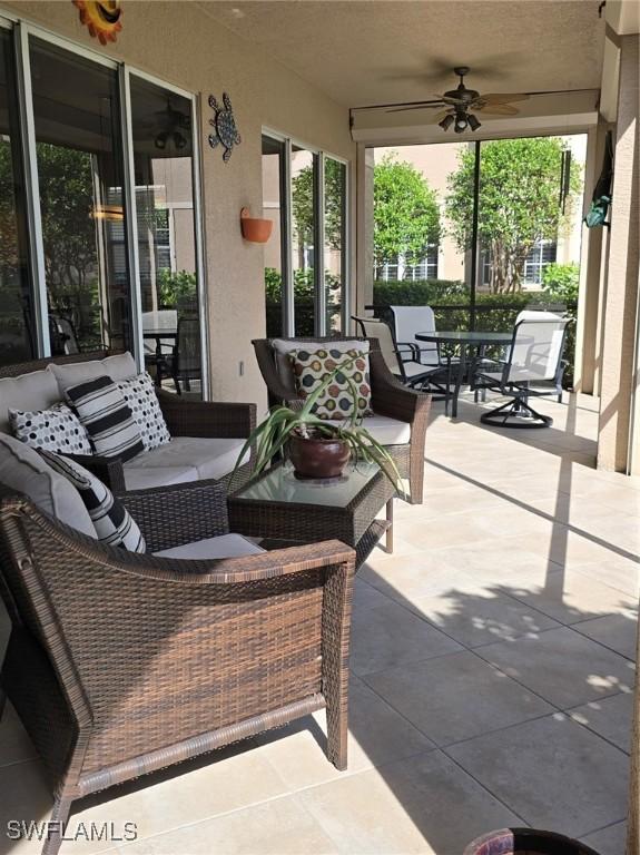 view of patio featuring ceiling fan