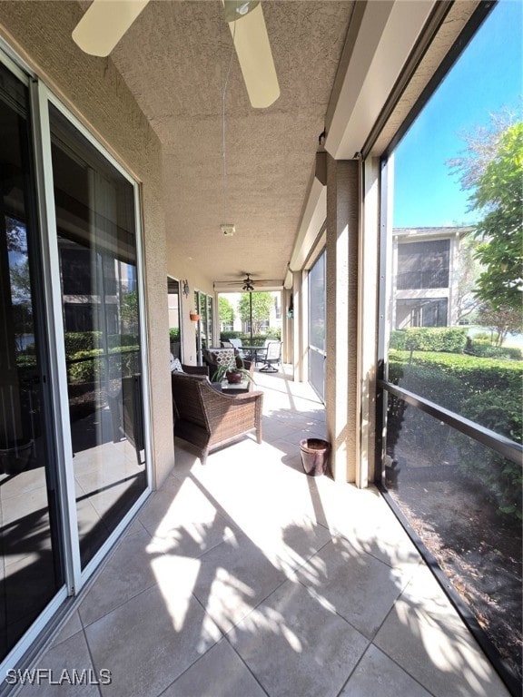 view of patio featuring ceiling fan