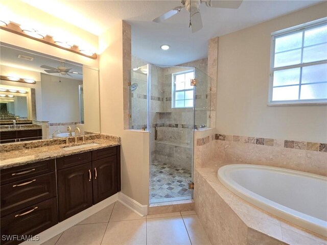 bathroom with tile patterned flooring, shower with separate bathtub, vanity, and ceiling fan