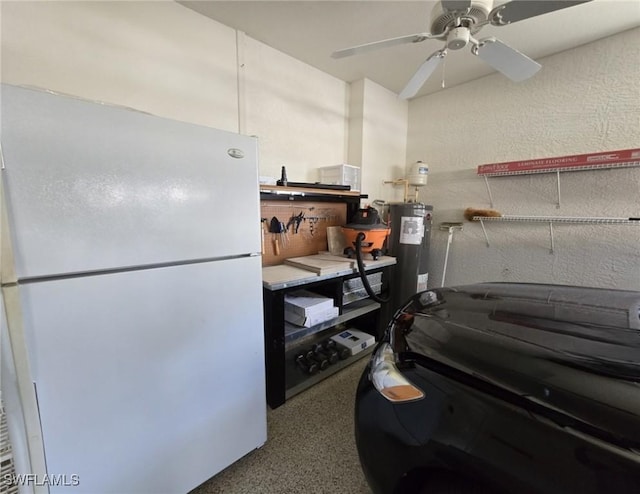 kitchen featuring water heater, ceiling fan, and white refrigerator