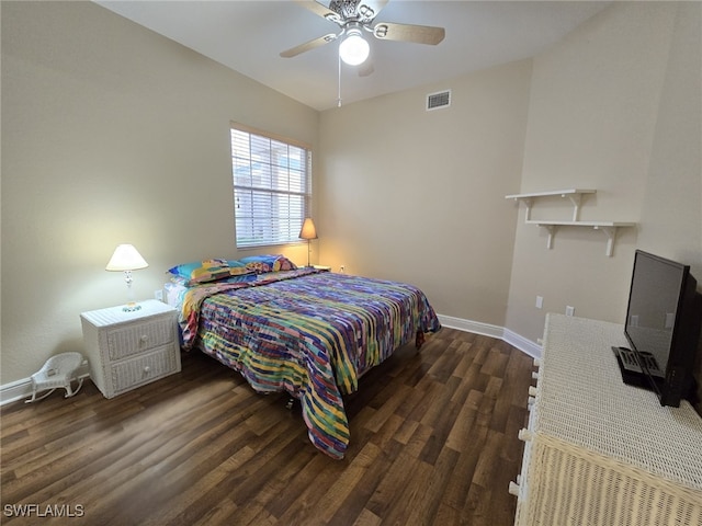 bedroom with ceiling fan and dark hardwood / wood-style floors