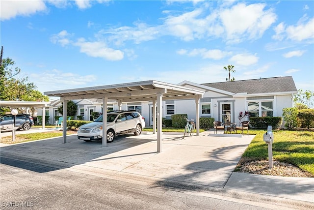 exterior space with a carport