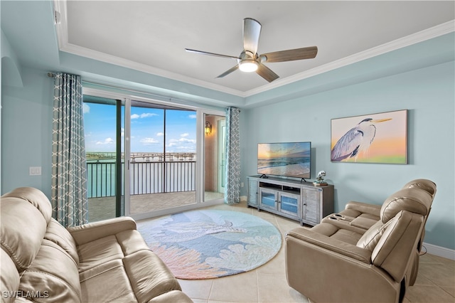 living room featuring ceiling fan, light tile patterned floors, and crown molding