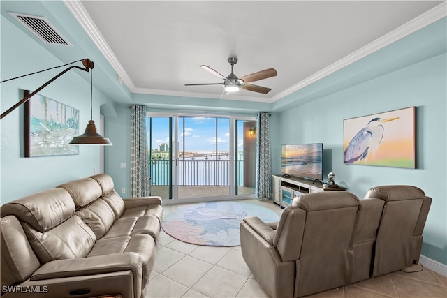 living room with ceiling fan, light tile patterned floors, and ornamental molding