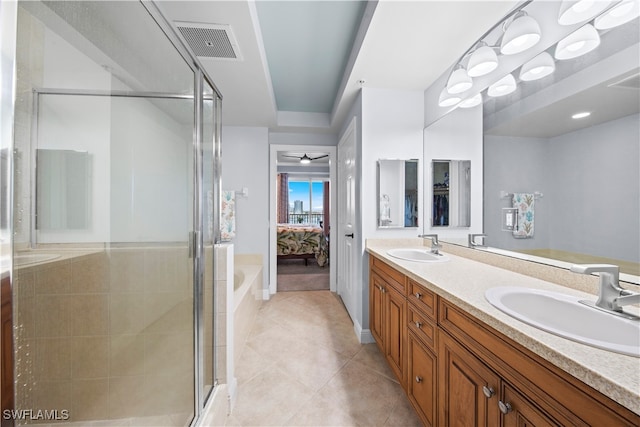 bathroom featuring ceiling fan, tile patterned flooring, vanity, and walk in shower