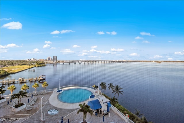 view of pool featuring a water view