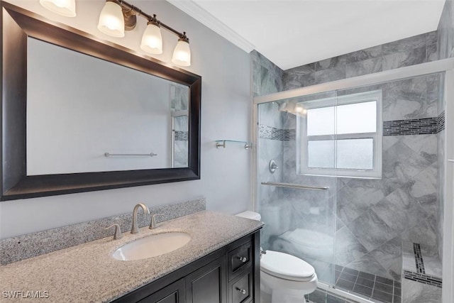 bathroom with crown molding, vanity, toilet, and an enclosed shower