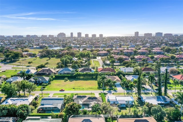 birds eye view of property featuring a residential view and a view of city