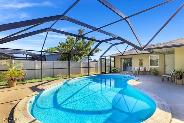 view of swimming pool with a fenced in pool, a lanai, and a patio area