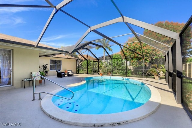 outdoor pool with a lanai and a patio