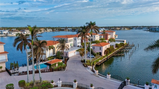 water view featuring a residential view and fence