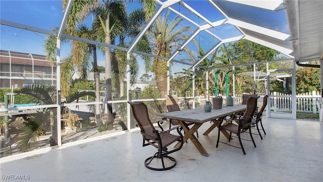 view of patio with glass enclosure