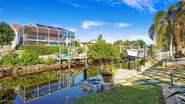 dock area featuring glass enclosure and a water view