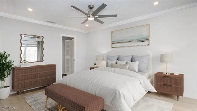 bedroom featuring light hardwood / wood-style flooring, ceiling fan, and ornamental molding