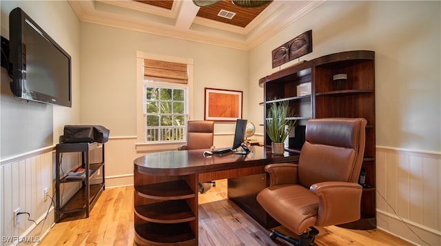 office area with beam ceiling, light hardwood / wood-style flooring, coffered ceiling, and ornamental molding