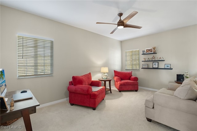 living room with light carpet and ceiling fan