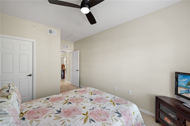 bedroom featuring light colored carpet and ceiling fan