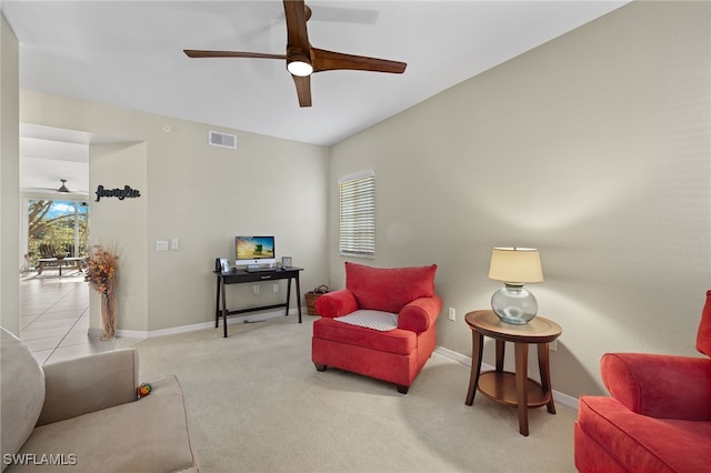 sitting room featuring ceiling fan and light colored carpet