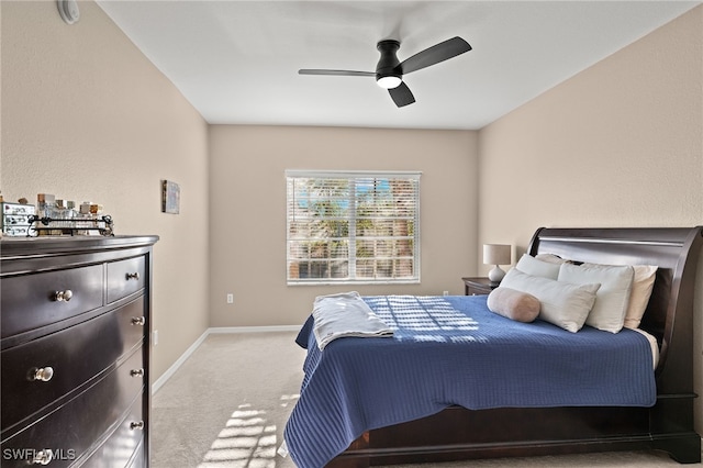 bedroom with ceiling fan and light colored carpet