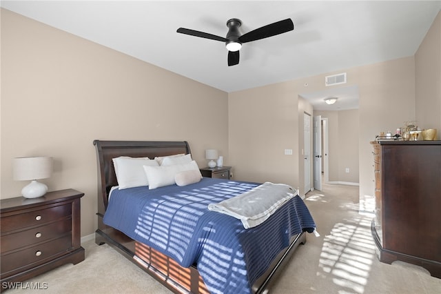 bedroom featuring ceiling fan and light carpet