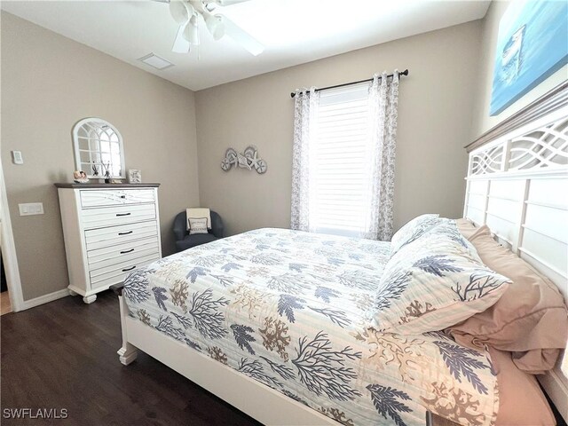 bedroom featuring ceiling fan and dark hardwood / wood-style floors