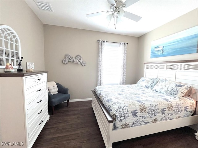 bedroom featuring ceiling fan and dark wood-type flooring