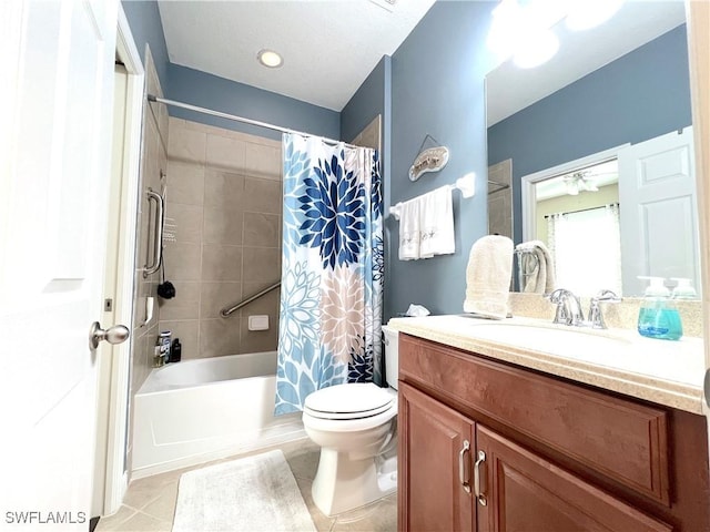 full bathroom with tile patterned floors, shower / bath combo, toilet, and vanity