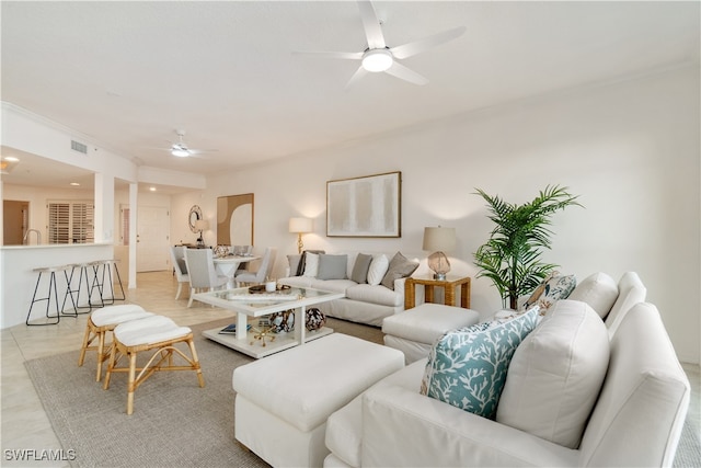 living room with ceiling fan and light tile patterned flooring