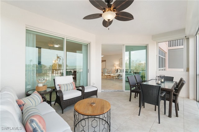 sunroom featuring ceiling fan