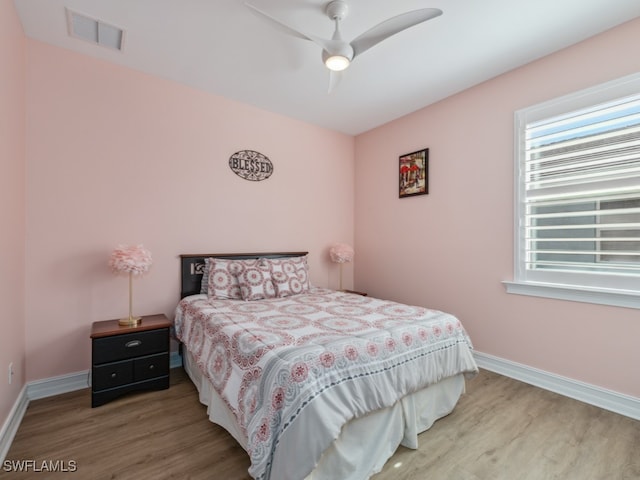 bedroom featuring ceiling fan and hardwood / wood-style floors