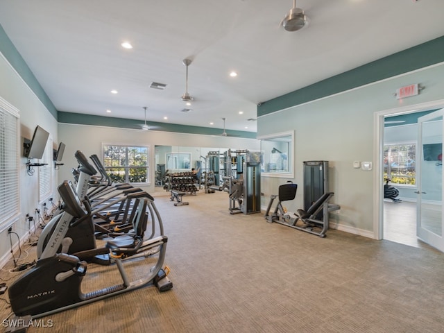 gym featuring light colored carpet and ceiling fan