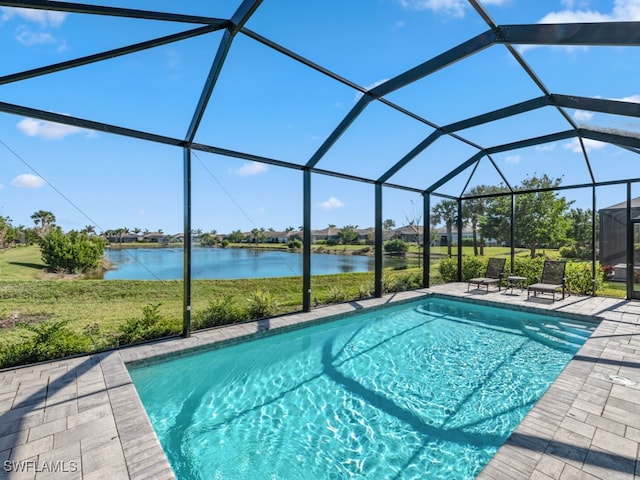 view of pool featuring a lanai, a patio area, and a water view