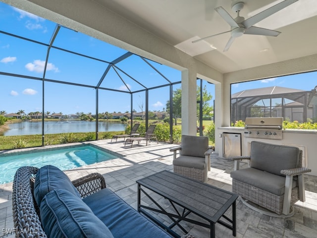 view of patio / terrace featuring ceiling fan, an outdoor kitchen, an outdoor hangout area, area for grilling, and a water view