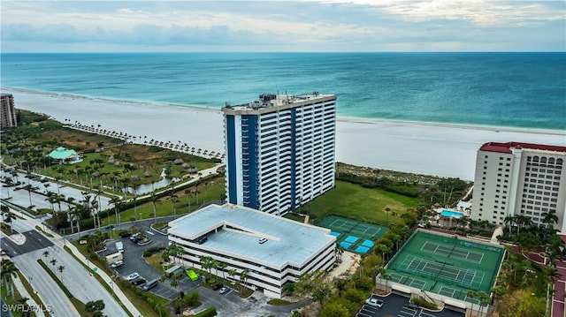 drone / aerial view featuring a view of the beach and a water view