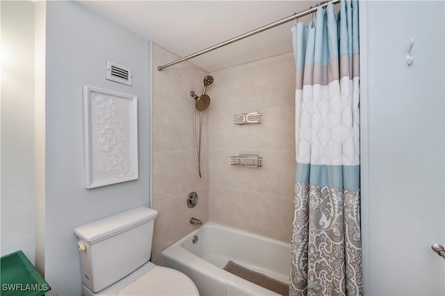 bathroom with shower / bath combo and toilet